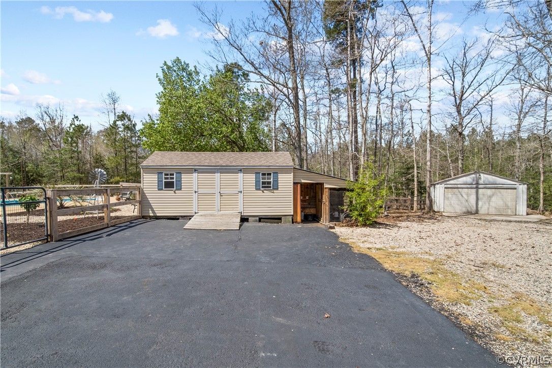 12700 Coalboro Road Chesterfield, VA 23838 - Photo 48 of 50 a front view of a house with a road and trees