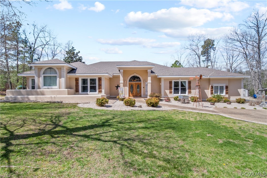 12700 Coalboro Road Chesterfield, VA 23838 - Photo 49 of 50 a front view of a house with yard patio and fire pit