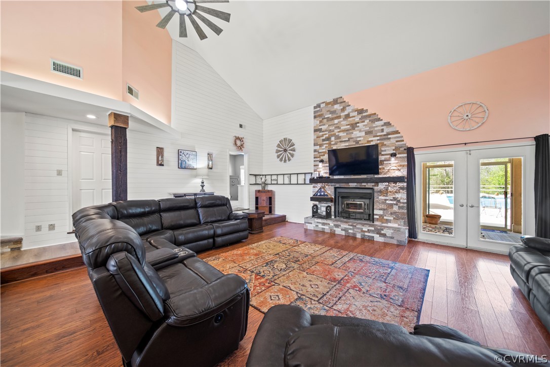 12700 Coalboro Road Chesterfield, VA 23838 - Photo 9 of 50 a living room with furniture a flat screen tv and a fireplace