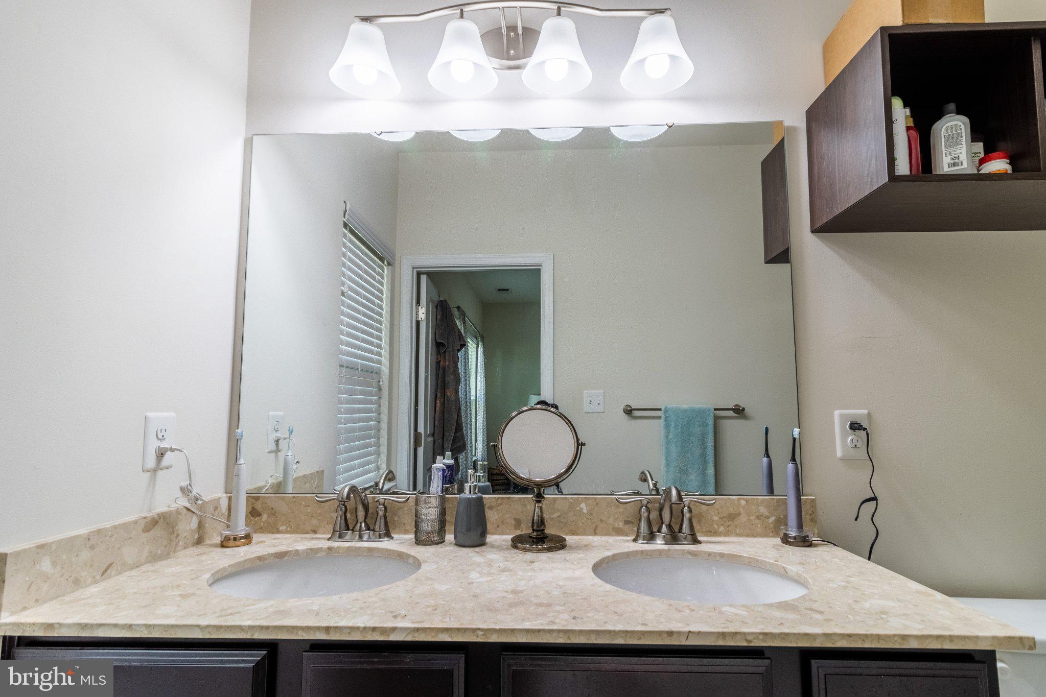 4658 Hudson Street Baltimore, MD 21224 - Photo 29 of 35 Elegant dual-sink bathroom oasis.