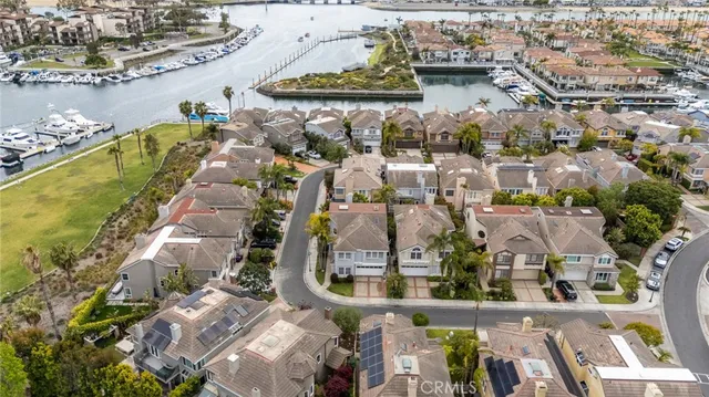 an aerial view of a house with a lake view