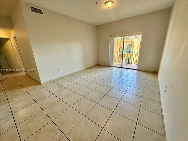 a view of an empty room and window