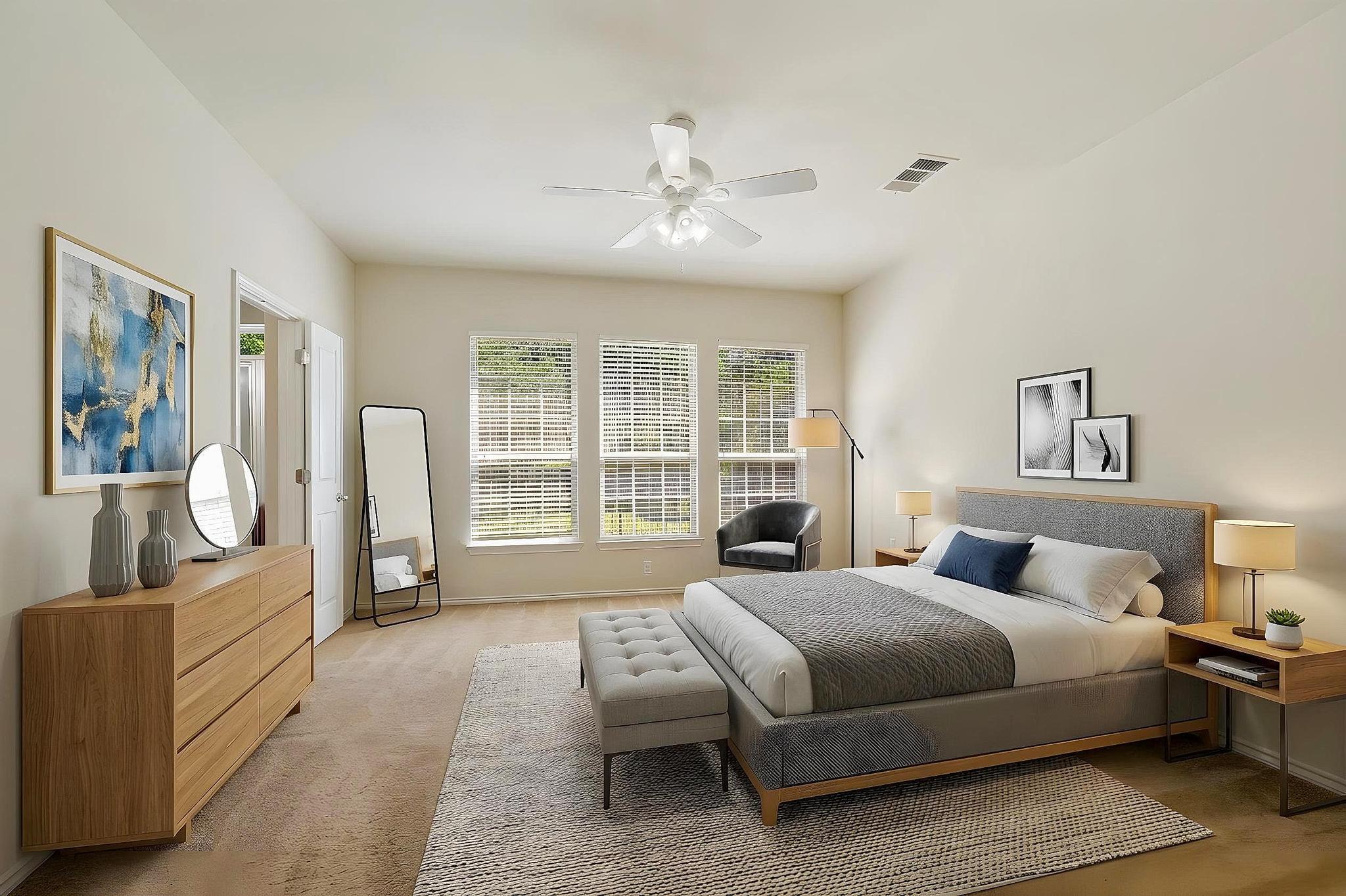 520 Mill Pond Path Georgetown, TX 78633 - Photo 23 of 38 Natural light floods this spacious bedroom, enhancing its inviting ambiance.