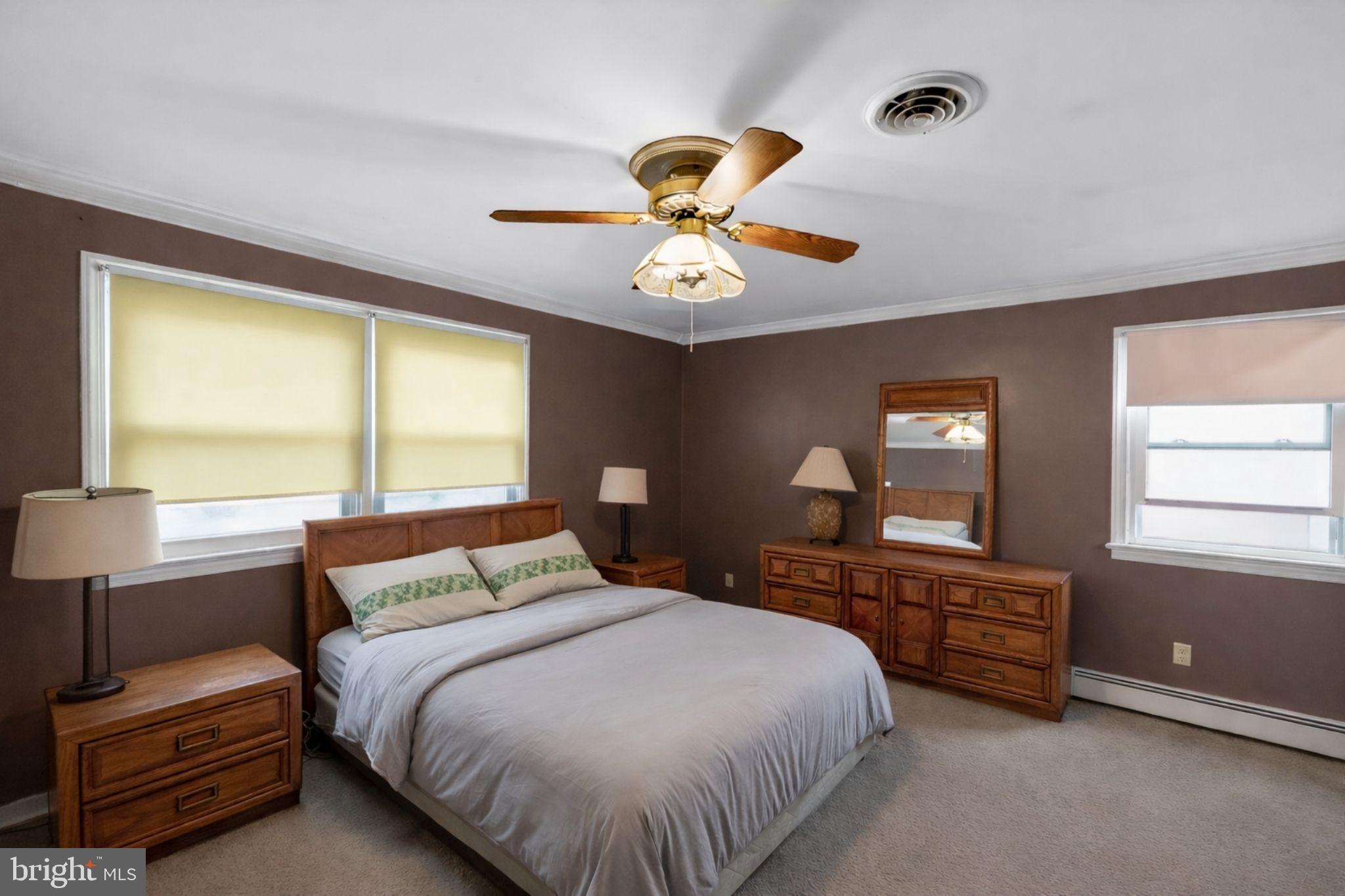 10509 North Keys Road Brandywine, MD 20613 - Photo 13 of 30 a bedroom with a bed and a chandelier