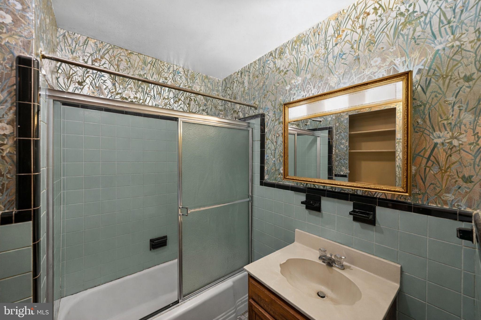 10509 North Keys Road Brandywine, MD 20613 - Photo 19 of 30 a bathroom with a sink mirror and shower