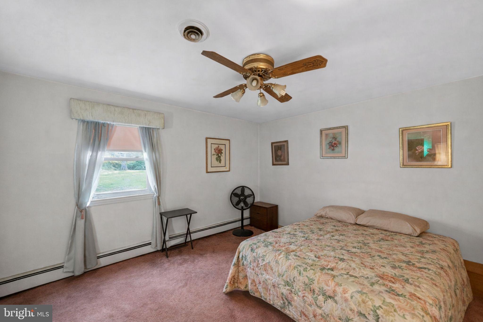10509 North Keys Road Brandywine, MD 20613 - Photo 20 of 30 a bedroom with a bed and a window