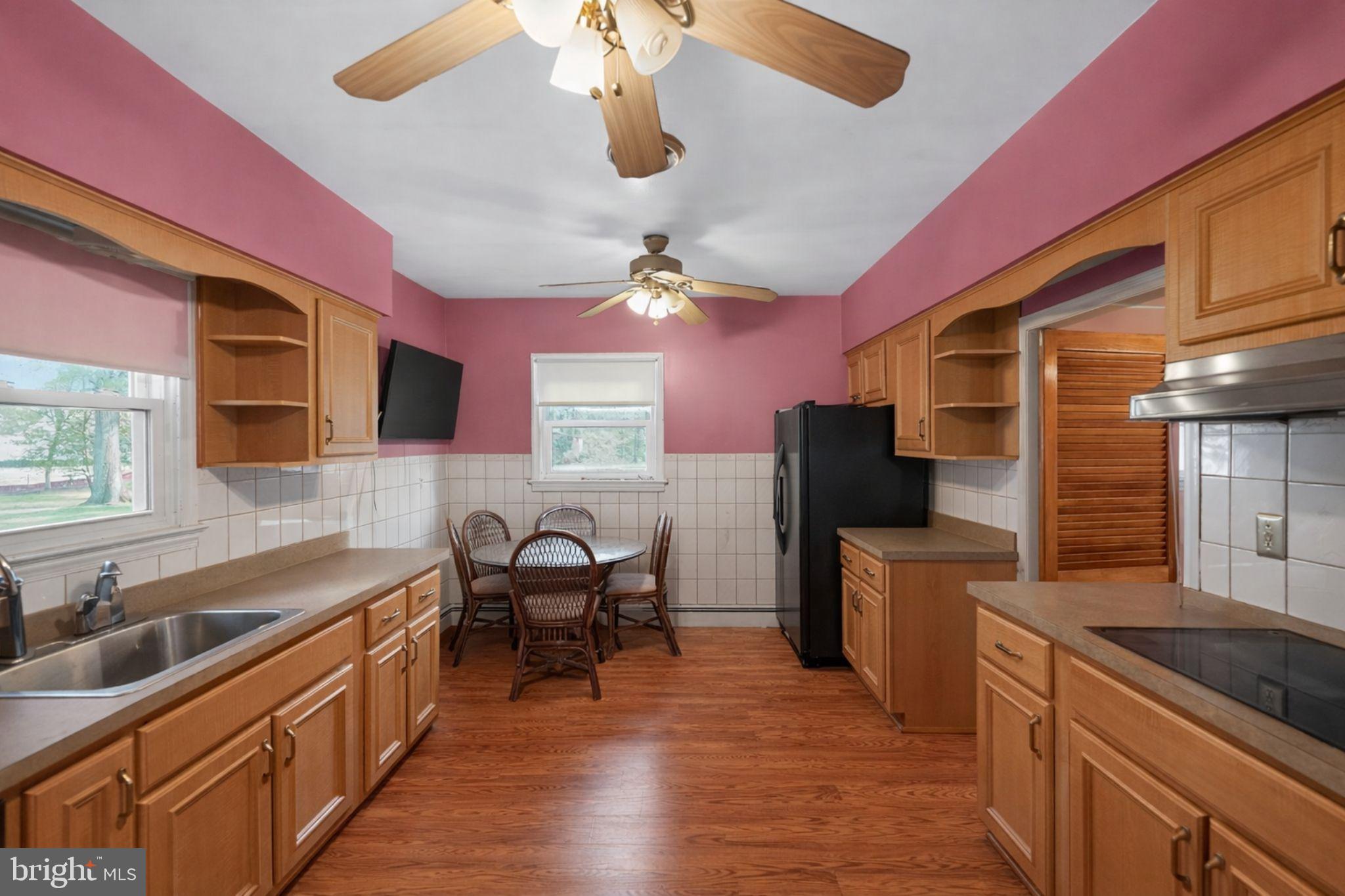 10509 North Keys Road Brandywine, MD 20613 - Photo 6 of 30 a kitchen with stainless steel appliances granite countertop a sink and a stove