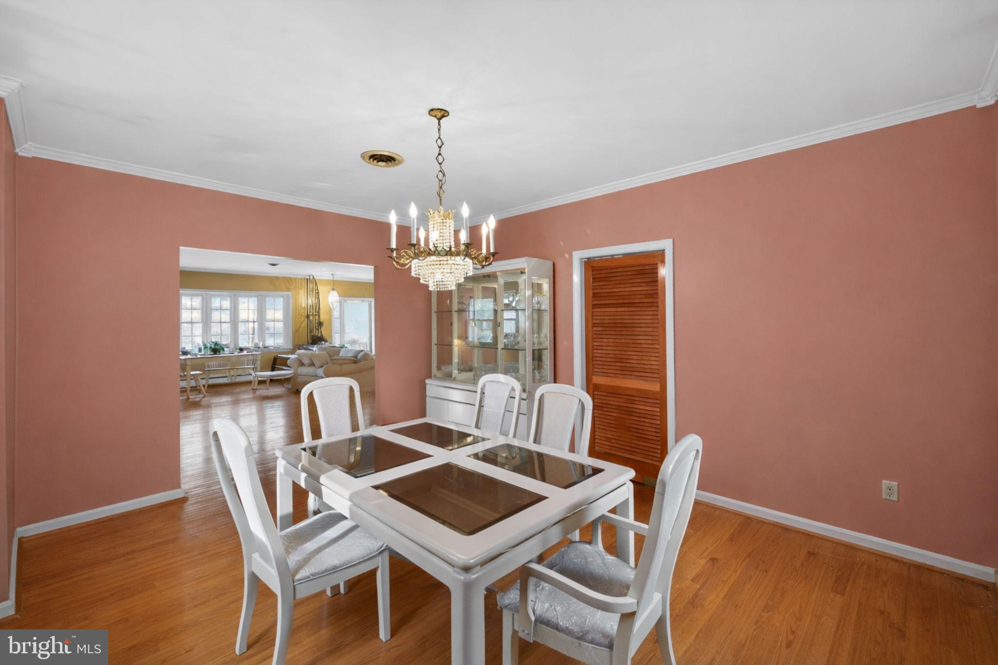 10509 North Keys Road Brandywine, MD 20613 - Photo 9 of 30 a view of a dining room with furniture wooden floor and chandelier