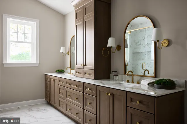 a bathroom with a double vanity sink and a mirror