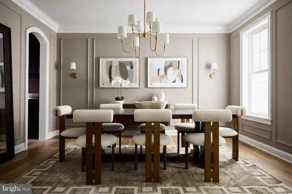 a view of a a dining room with furniture window and wooden floor