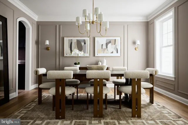 a view of a a dining room with furniture window and wooden floor