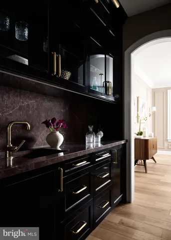 a kitchen with a sink and cabinets