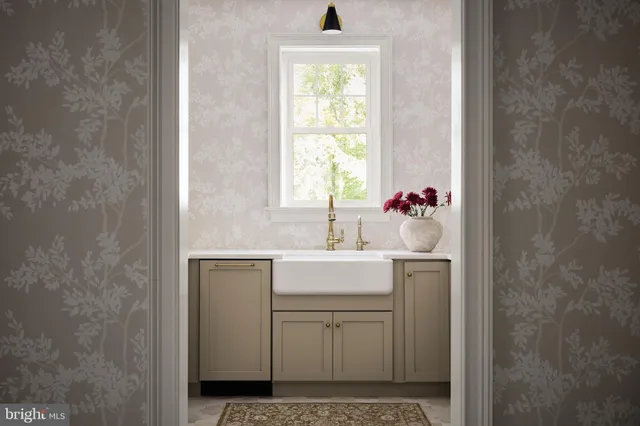 a bathroom with a sink toilet and window