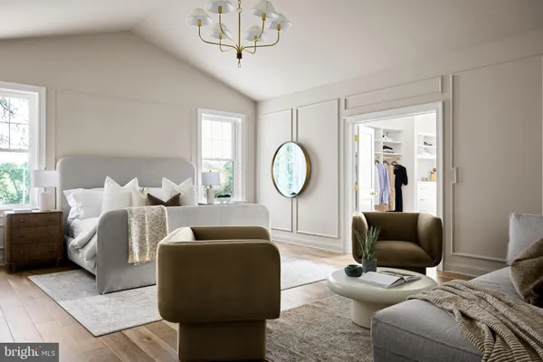 a living room with furniture a mirror and a large window
