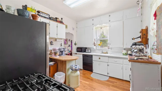 a kitchen with a sink stove and refrigerator