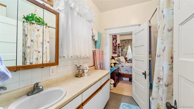 a bathroom with a sink double vanity and a mirror