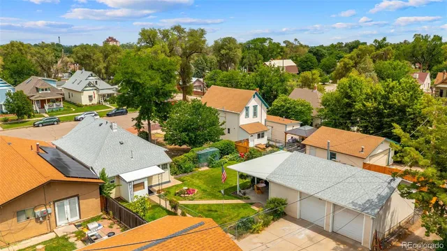an aerial view of multiple houses with yard