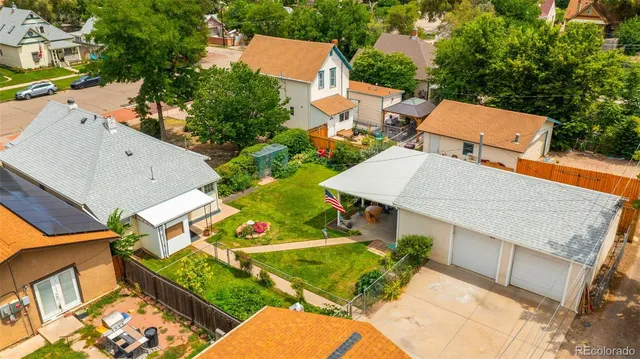 an aerial view of a house with porch