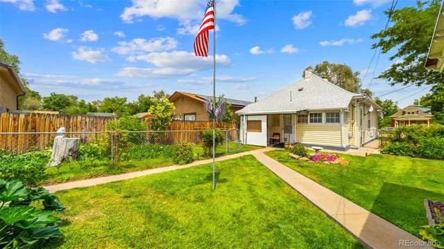 a view of an house with backyard outdoor seating and entertaining space