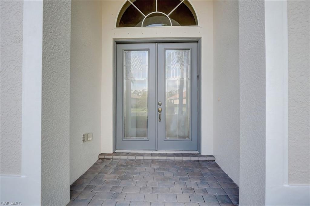 16092 Parque Lane Naples, FL 34110 - Photo 2 of 35 a view of a door in a hallway