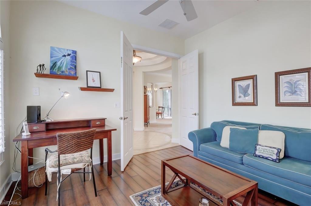16092 Parque Lane Naples, FL 34110 - Photo 23 of 35 a view of a dining room with furniture and wooden floor