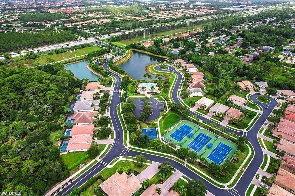 16092 Parque Lane Naples, FL 34110 - Photo 35 of 35 an aerial view of residential house with outdoor space and swimming pool