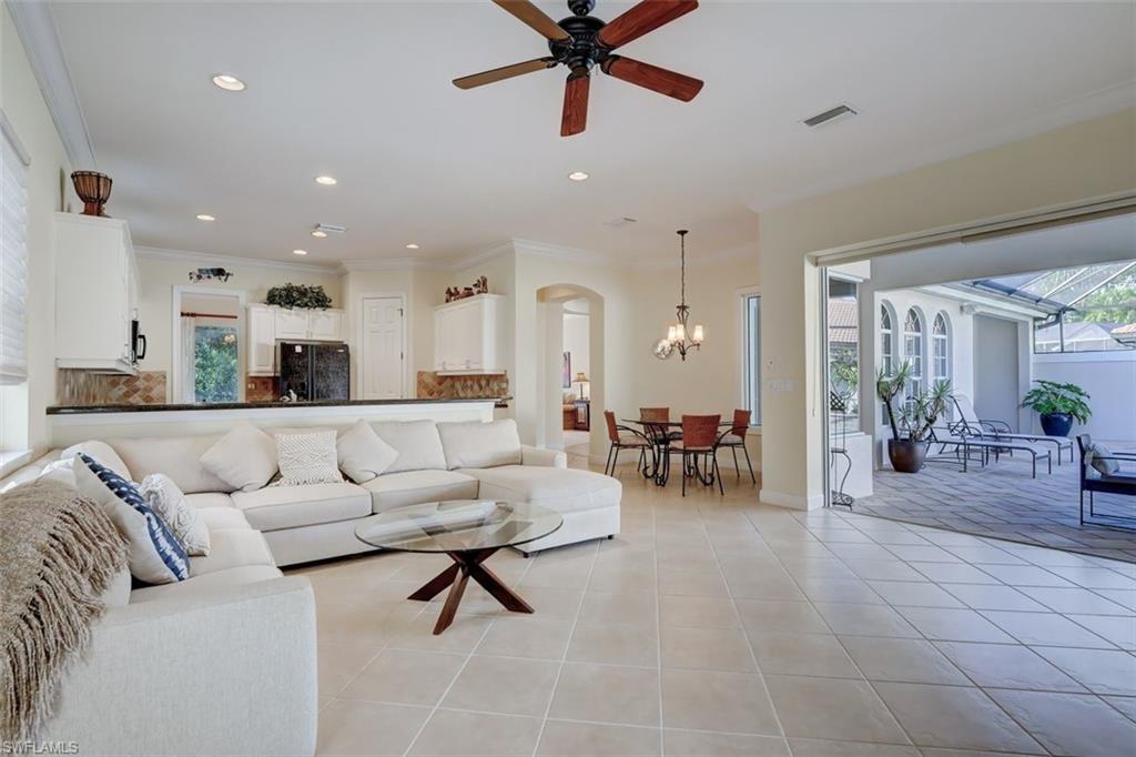 16092 Parque Lane Naples, FL 34110 - Photo 7 of 35 a living room with furniture and kitchen view
