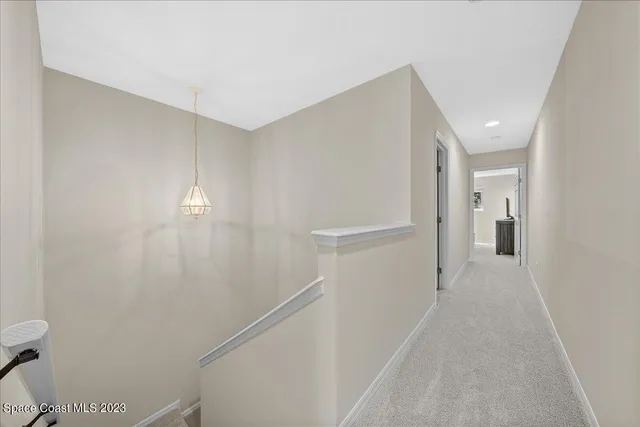 a view of hallway with stairs