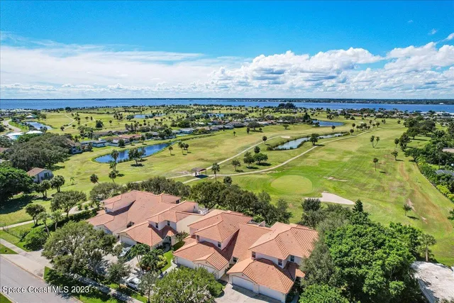 an aerial view of ocean with residential house with outdoor space
