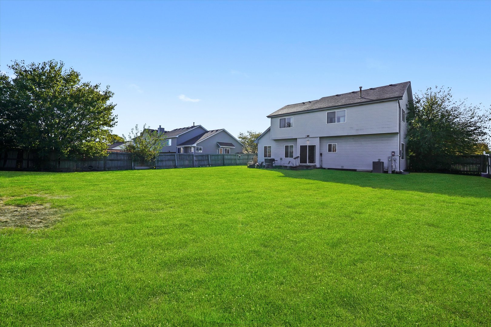 731 Bobwhite Lane New Lenox, IL 60451 - Photo 20 of 26 a view of a house with a yard and a porch
