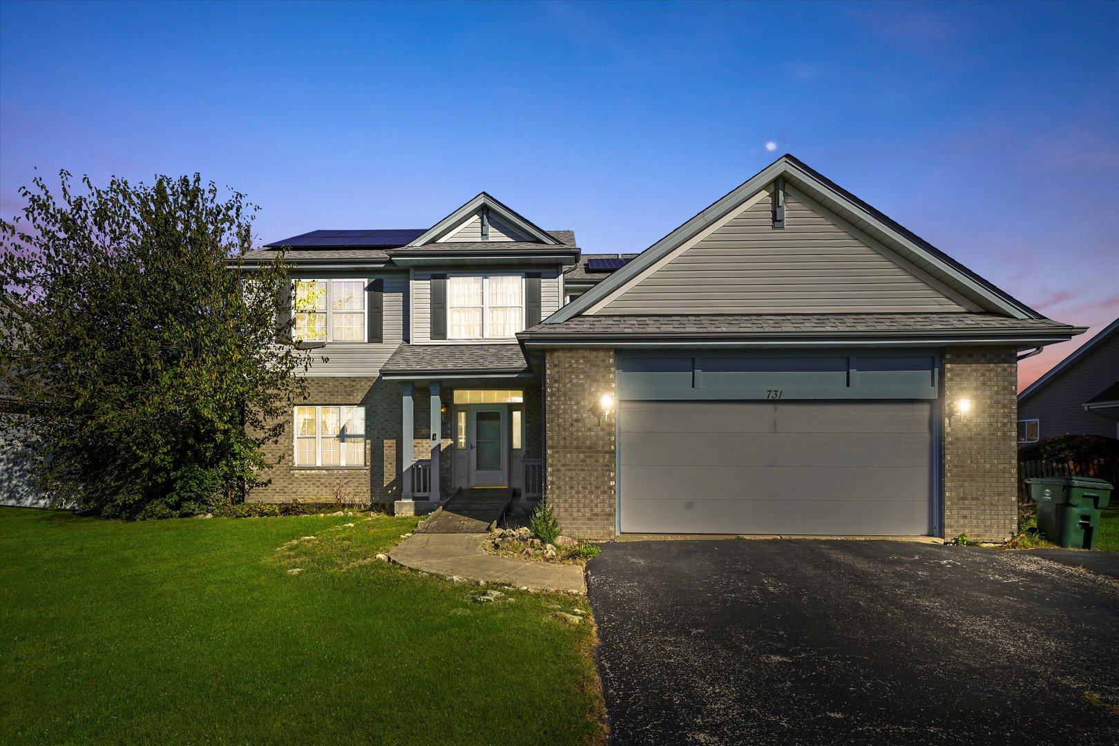 731 Bobwhite Lane New Lenox, IL 60451 - Photo 26 of 26 a front view of a house with a yard and garage