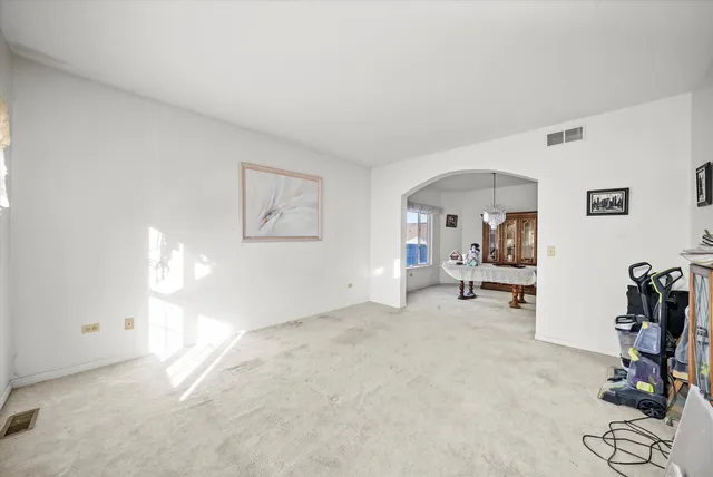 a view of a livingroom with furniture and white walls