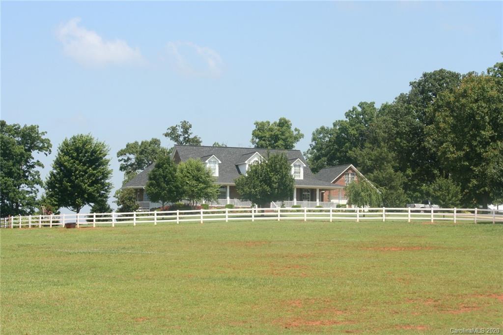 a view of a swimming pool with an outdoor space and seating area