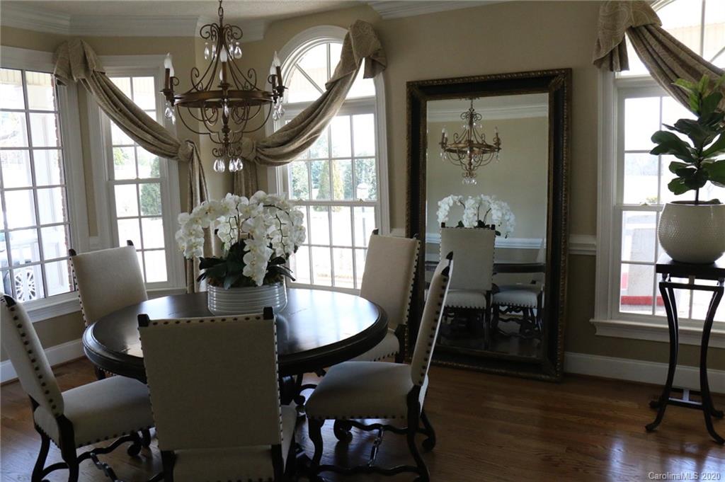 3215 Startown Road Lincolnton, NC 28092 - Photo 15 of 39 a view of a dining room with furniture window and wooden floor