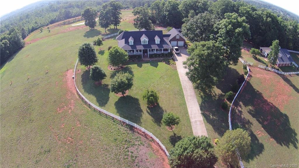 3215 Startown Road Lincolnton, NC 28092 - Photo 3 of 39 an aerial view of a house with a yard and lake view
