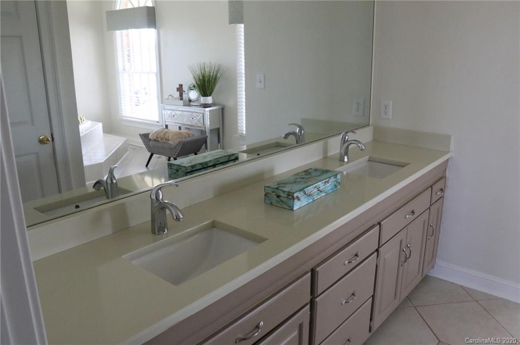 3215 Startown Road Lincolnton, NC 28092 - Photo 22 of 39 a bathroom with a granite countertop sink a mirror and next to a window