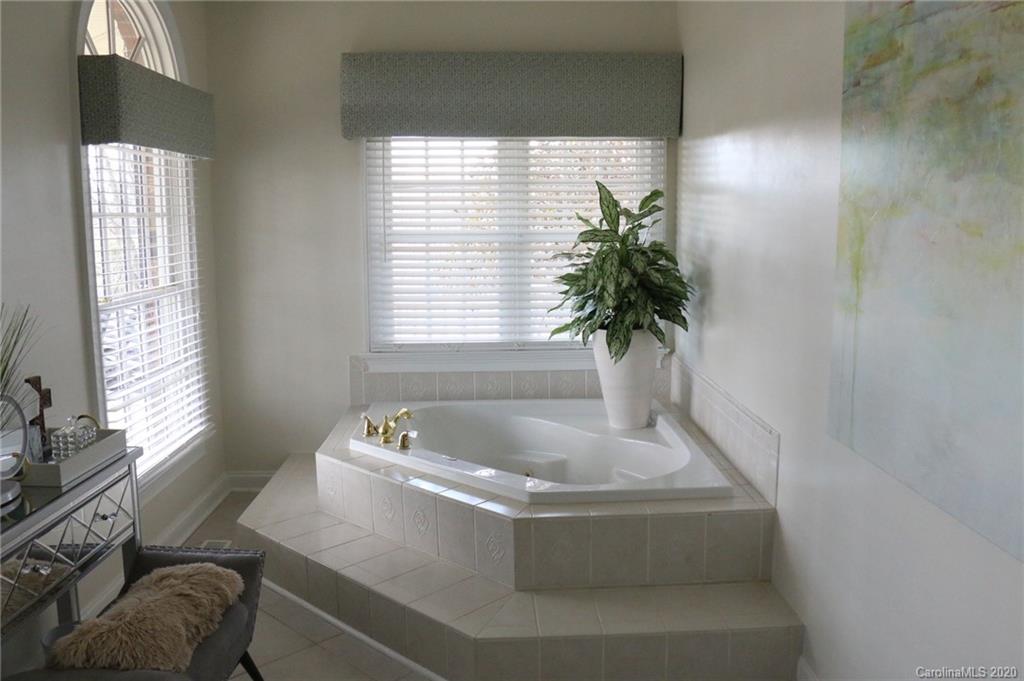 3215 Startown Road Lincolnton, NC 28092 - Photo 23 of 39 a bath tub sitting in a bathroom next to a window