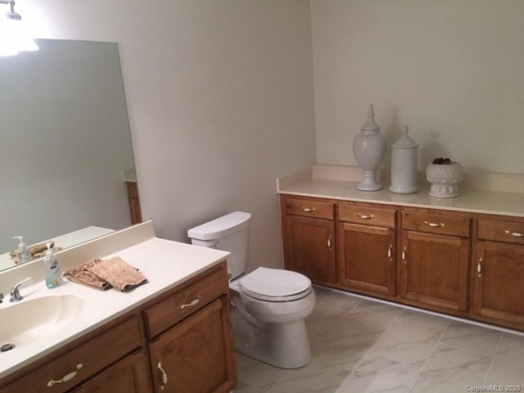 3215 Startown Road Lincolnton, NC 28092 - Photo 25 of 39 a bathroom with a sink a toilet and vanity
