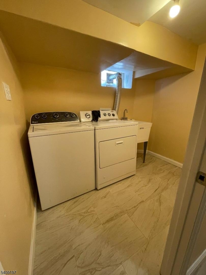 25 Bayview Avenue Newark, NJ 07112 - Photo 14 of 15 a utility room with dryer and washer