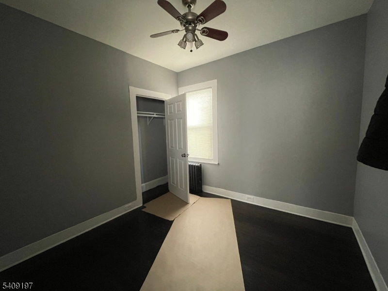 25 Bayview Avenue Newark, NJ 07112 - Photo 6 of 15 a view of a hallway with a chandelier