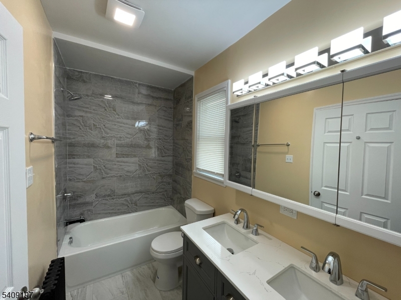 25 Bayview Avenue Newark, NJ 07112 - Photo 10 of 15 a bathroom with a sink tub toilet and shower