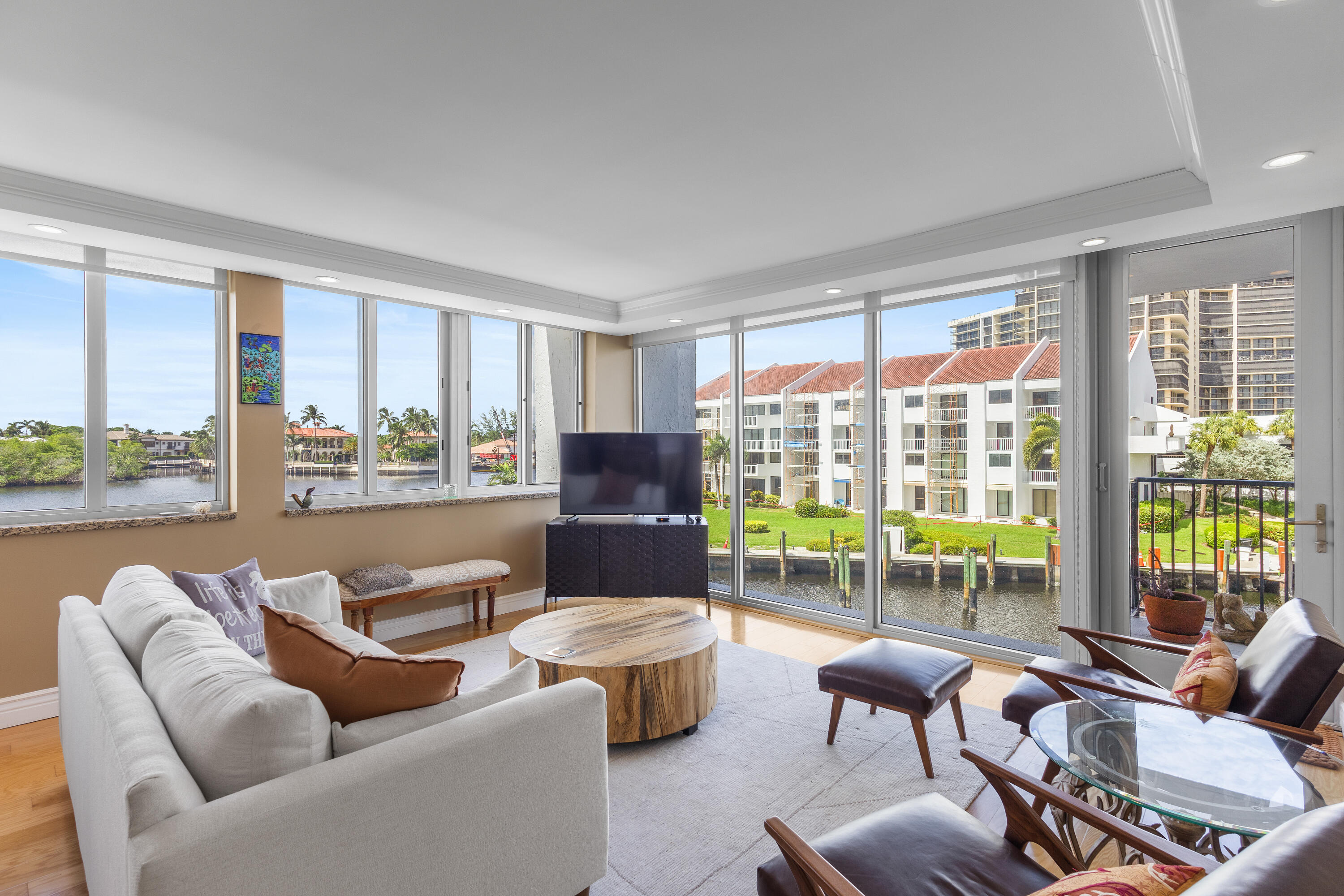 4750 South Ocean Boulevard, Unit 204 Highland Beach, FL 33487 - Photo 3 of 30 a living room with furniture and floor to ceiling windows