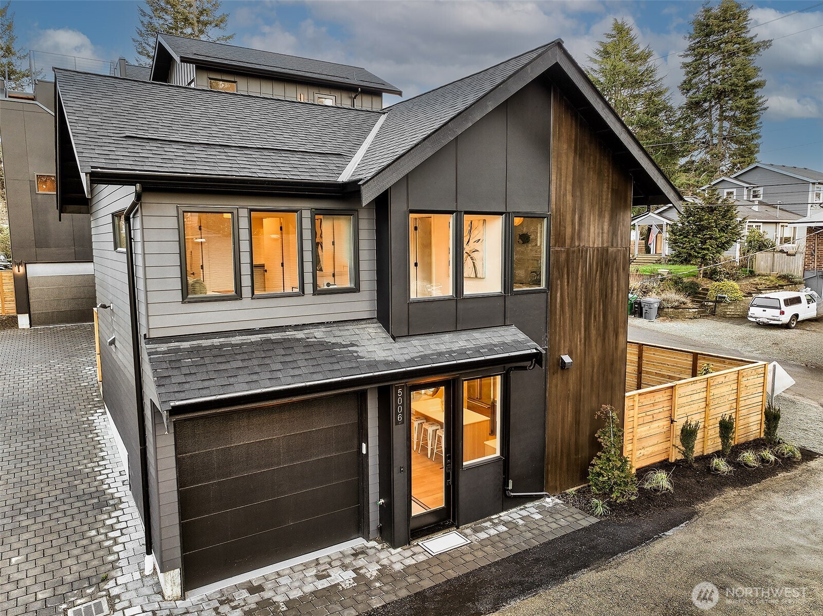 a front view of a house with garage