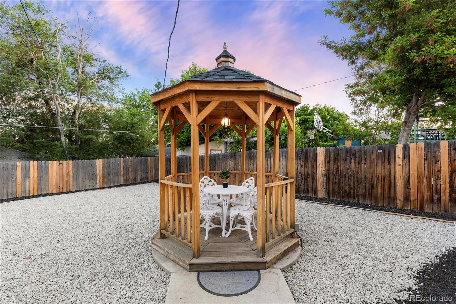 4904 West 61st Drive Arvada, CO 80003 - Photo 33 of 37 a view of a chair and table in backyard