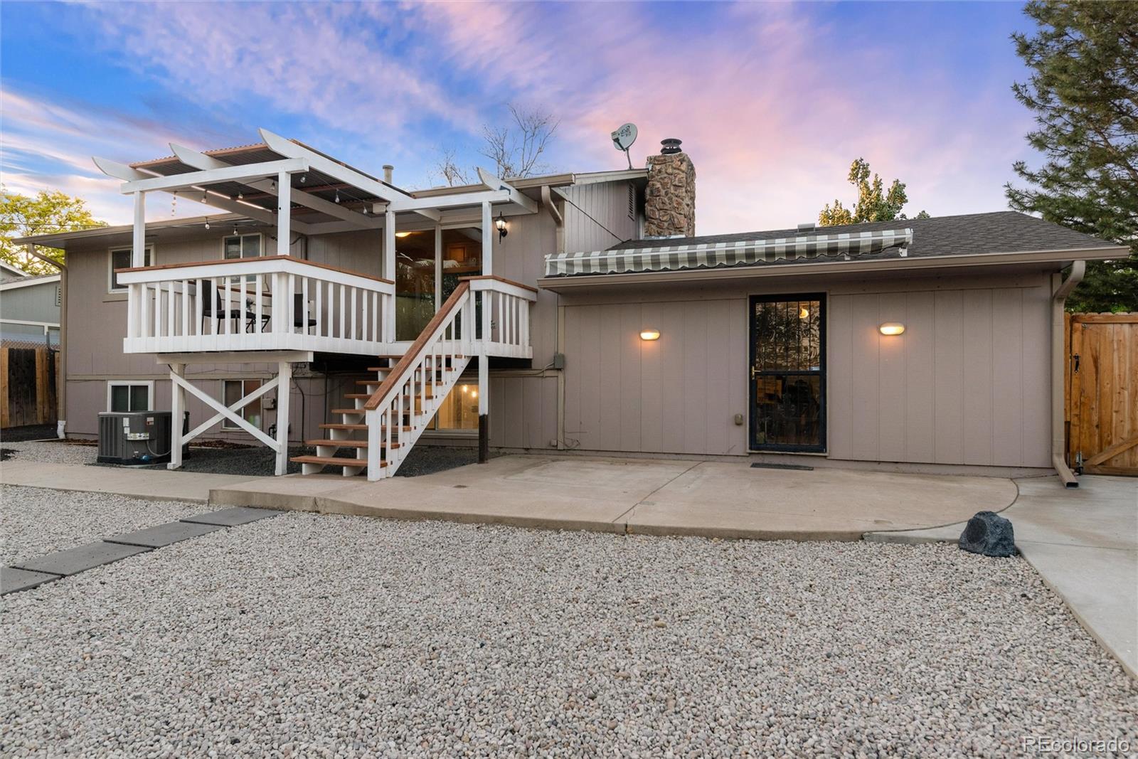 4904 West 61st Drive Arvada, CO 80003 - Photo 35 of 37 a view of a house with wooden deck