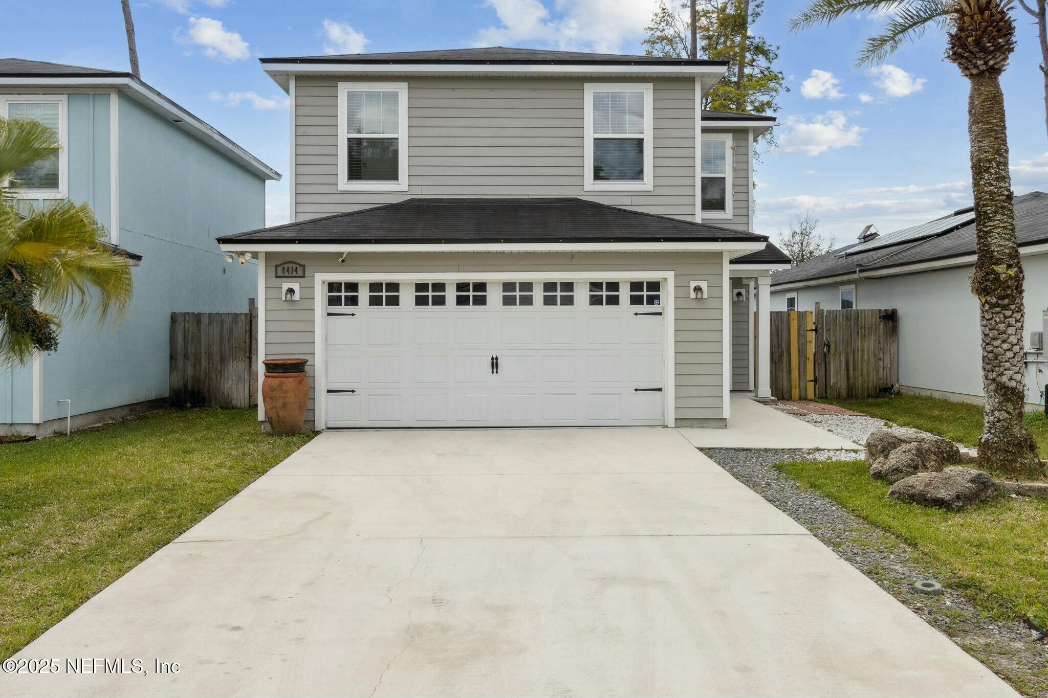 8414 Thor Street Jacksonville, FL 32216 - Photo 1 of 40 a view of a house with a yard