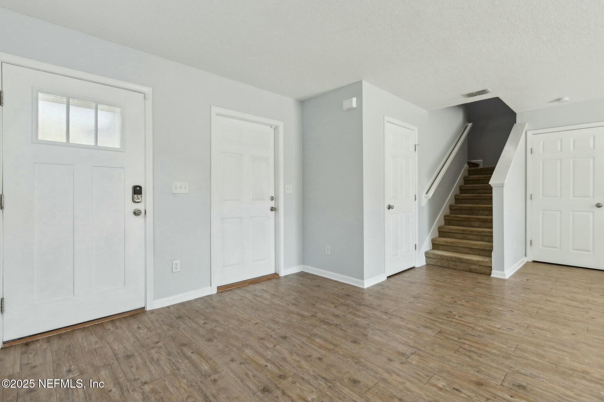 8414 Thor Street Jacksonville, FL 32216 - Photo 11 of 40 a view of entryway with wooden floor