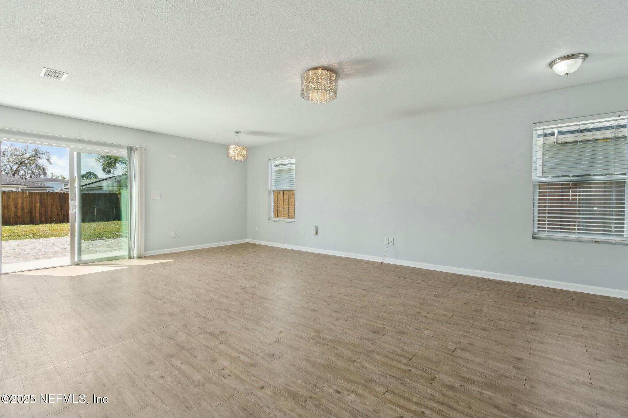 8414 Thor Street Jacksonville, FL 32216 - Photo 16 of 40 a view of an empty room with a window