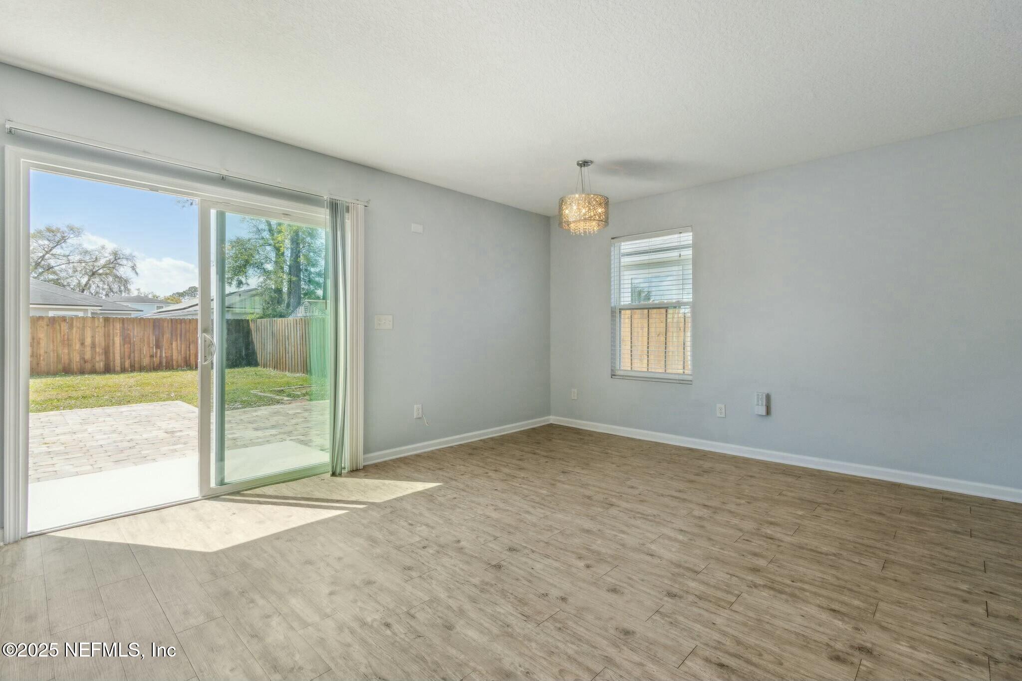 8414 Thor Street Jacksonville, FL 32216 - Photo 18 of 40 a view of an empty room with a window