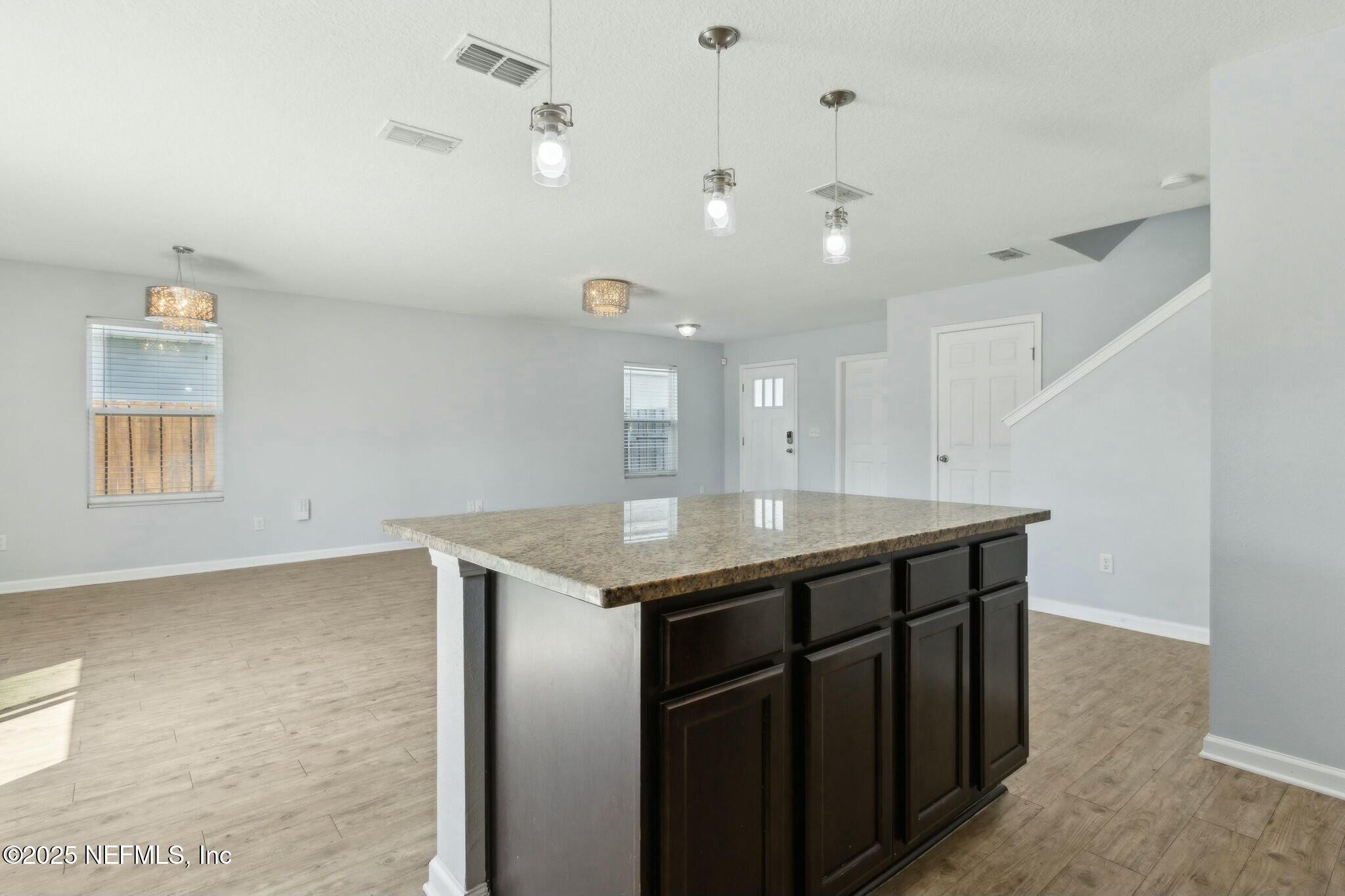 8414 Thor Street Jacksonville, FL 32216 - Photo 21 of 40 a kitchen with a sink a counter space and appliances